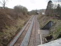 Wennington signal box was in the recess but was removed in 2006 having been switched out for many years. The signalling block section now extends from Carnforth to Settle Junction. Picture taken looking west towards the former junction for Lancaster where the remaining line swings right towards Melling and Carnforth. The signalbox has gone to the Poulton and Wyre Railway Society.<br><br>[Mark Bartlett 14/04/2008]