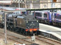 Black Five 45407 at the rear of the North Briton finalising the second leg of day 2 from Dundee to Perth. This was a unique sight - a top and tailed 13 coach passenger train with both locomotives running tender first. They ran over the former D&PR on to the down main line at Perth then drew forward into platform 7 where this picture was taken (see 18634). Alongside are stables class 170 DMU sets in platforms 6&5.<br><br>[Brian Forbes 13/04/2008]