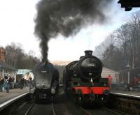 60009 <I>Union of South Africa</I> casts a dark cloud over Grosmont station on 3 April waiting for the level crossing gates. Meantime 61264 stands at the head of a train for Pickering boarding at the adjacent platform.  <br><br>[John Furnevel 03/04/2008]