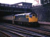 A class 27 locomotive at the head of a service for Edinburgh Waverley about to leave Glasgow Queen Street in 1974.<br><br>[John McIntyre //1974]