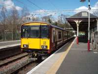318265 stands at Milngavie on 17 April awaiting the arrival of a 320 unit on the single line before starting its return journey to Larkhall.<br><br>[Mark Bartlett 17/04/2008]