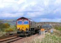 66207 heading south with three empty flat wagons.<br><br>[Brian Forbes 15/04/2007]