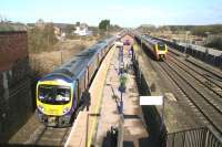 The 11.34 Manchester Airport - Middlesbrough First TransPennine service about to leave Thirsk on 1 April 2008 as a northbound Cross Country Voyager runs through the station on the down fast line.<br><br>[John Furnevel 01/04/2008]
