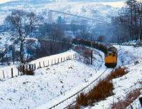 25233 with a freight in the snow at Dufftown on 5 February 1979.<br><br>[Peter Todd 05/02/1979]