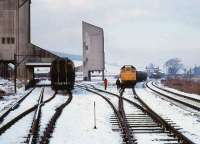 Winters day at Dufftown on 5 February 1979 with 25233 standing in the yard at the head of a freight.<br><br>[Peter Todd 05/02/1979]