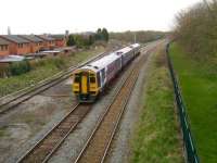 158 752 westbound at Lostock Hall Junction approaching the station with a York - Blackpool North service on 19 April. The line to the left runs to Farington Junction and the southbound WCML, while the train is heading for Farington Curve Junction thence north on the main line towards Preston. <br><br>[John McIntyre 19/04/2008]