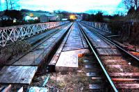 Railway bridge at Ruswarp looking to Grosmont viewed from the level crossing. This night shot shows that the line was formerly double track.<br><br>[Ewan Crawford 02/04/2008]