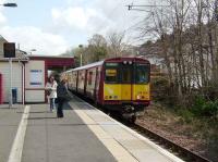 314 203 with a service for Glasgow Central via Maxwell Park stands at Kings Park station on 19 April 2008.<br><br>[David Panton 19/04/2008]