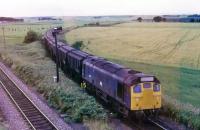 25234 approaching the junction of the Hopeman branch with the Inverness - Aberdeen line at Alves on 3 August 1979 with a Burghead - Dufftown working.<br><br>[Peter Todd 03/08/1979]