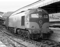 CIE 056 stands at the buffer stops in Cork station with parcels vans in 1988.<br><br>[Bill Roberton //1988]