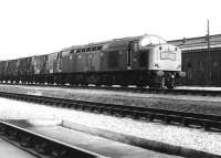 A southbound freight hauled by EE Type 4 D351 runs past the former steam shed at Carlisle Kingmoor in April 1971. <br><br>[John Furnevel 02/04/1971]