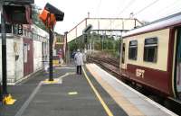 A Helensburgh service stands at Dalreoch on 9 September 2007. Dalreoch Junction and the line turning north to Balloch lie just beyond the end of the platform.<br><br>[John Furnevel 09/09/2007]