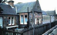 The former Highland Railway station at Moy, photographed from a passing train in August 1985, 20 years after closure. Note the HR insignia and the old ticket office window.<br><br>[David Panton /08/1985]