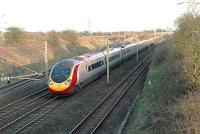 Glasgow bound Pendolino north of the former Rockcliffe station at the point where the up slow line begins its climb to the flyover into Carlisle Marshalling Yard.<br><br>[Ewan Crawford 14/04/2008]