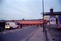 A Harrogate bound Pacer hurries over the level crossing at Starbeck on the evening of 12 March 2002.<br><br>[Ewan Crawford 12/03/2002]