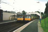 303s at Neilston in July 1998. 055 (left) about to leave to return to Glasgow Central and 019 just arrived.<br><br>[David Panton /07/1998]