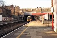 An eastbound InterCity 125 HST service heading for Paddington runs through Ealing Broadway at speed on 26 January 1990 [see image 34422].<br><br>[John McIntyre 26/01/1990]