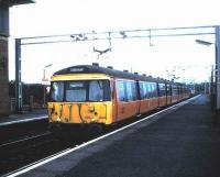 303 004 standing at Newton in August 1987 with a train for Dalmuir.<br><br>[David Panton /08/1987]