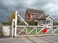 Marston Moor closed nearly 50 years ago (17 September 1958) on the same day as nearby Hessay but still has a small signal box controlling the level crossing on the single line section to Poppleton. View towards Hammerton.<br><br>[Mark Bartlett 28/04/2008]