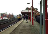 An Exeter - Waterloo service arrives at Tisbury, Wiltshire in February 1992 behind a class 33 locomotive.<br><br>[John McIntyre 27/02/1992]