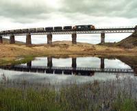 37 405 takes a southbound freight over the viaduct on the northern approach to Rannoch station in the 1980s.<br><br>[Bill Roberton //]