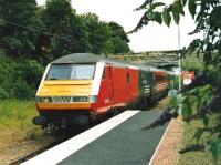 Scene at North Berwick station in July 2004 as DVT 82 132 arrives through the Buddleia with a service from Waverley.<br><br>[David Panton /07/2004]
