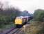 A pair of class 37s with a coal train near Ammanford Colliery Halt, Carmarthenshire, on 3 May 1988.<br><br>[Ian Dinmore 03/05/1988]