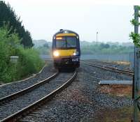 To the left a train enters the Bathgate terminus (which is on roughly the location of the original Bathgate terminus) and to the right the stub of the closed line west to Bathgate Upper, Airdrie and Glasgow. For some odd reason the stub has recently been cut back. But things are going to change ...<br><br>[Ewan Crawford 10/05/2008]