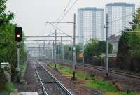 What had two, then four, now has two again and will soon have three? View east from Hillington East showing the new gantries for overhead wires in connection with the additional line. Those masts in the foreground will be removed. An eastbound train approaches Cardonald in the distance.<br><br>[Ewan Crawford 10/05/2008]