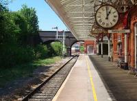 View along the Blackpool platform with No. 3 box visible under the bridge. Poulton is in excellent condition and it was 1 o clock. The former through line passed under the left hand arch. The bracket semaphore controls the junction with the disused Burn Naze and Fleetwood line<br><br>[Mark Bartlett 14/05/2008]