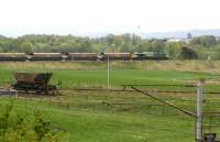 Freightliner 66509 approaches the buffer stops on the reversing spur at Ravenstruther shortly after leaving the West Coast Main Line (above which the overhead mast in the foreground stands) on 15 May 2008. The locomotive will reverse its empties along the siding in the centre of the picture and under the loading stage which is located off to the right. The solitary coal hopper on the left stands in the crippled wagon siding.<br><br>[John Furnevel 15/05/2008]