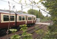 A Milngavie - Lanark service passing the site of Cleghorn station on 15 May 2008 prior to running over the level crossing. The train is approaching Lanark Junction, where it will turn south off the West Coast Main Line and onto the branch.<br><br>[John Furnevel 15/05/2008]