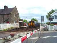 Two parallel single lines run from Bare Lane to Morecambe and 153360, on a service from Lancaster, is travelling towards the camera on the far line. The station house is a private residence and the signal box operates signals and points as well as the level crossing.<br><br>[Mark Bartlett 17/05/2008]