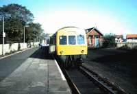 The branch train for Edinburgh Waverley, formed by DMU 101 302, stands at North Berwick in September 1984, just prior to the demolition of the station building and the remains of the second platform . <br><br>[David Panton /09/1984]