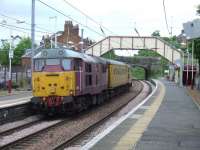 31601  at the rear of 31602 and a Network Rail coach passing through Johnstone heading east on 19th May<br><br>[Graham Morgan 19/05/2008]