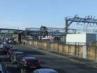 A Class 156 unit at the point where the line is crossed by the CGUR St Enoch approach railway bridge<br><br>[Graham Morgan 02/05/2008]