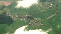 Aerial view of Carstairs. The route to Glasgow is to the left, to London to the bottom right, to Edinburgh to the top right and to Dolphinton to the centre right. Also visible is the so-called 'Queens Curve' (actually the original Edinburgh route, replaced when the Dolphinton Branch opened) from the line at the top right to the line at the bottom right. The station is centre left.<br><br>[Ewan Crawford 29/07/2001]