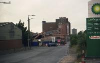 Looking west along Castlebank Street (a very different view these days) towards the Meadowside Granary. Partick West was to the right and a level crossing over the street served the granary. The granary was being demolished at the time.<br><br>[Ewan Crawford /07/2002]