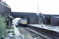 About a month before closure in June 1972 a Newton Heath Derby DMU calls at Ewood Bridge & Edenfield on a Bury to Rawtenstall service. Although the East Lancashire line has now been reopened Ewood Bridge was replaced by the new halt at Irwell Vale and the buildings and most of the two platforms have now gone. Freddie Thomas - one of five drivers in Bury diesel link is at the controls. From 1966 until 1972 a Cravens or Derby DMU was outstationed at Bury for the branch duties. View towards Bury - Map Ref SD 797208<br><br>[Mark Bartlett /05/1972]