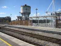 An old water tower still stands at the western end of Cardiff Central station with platform 0 in front of it. A corner of the Millennium Stadium is in the background on the right. 12 April 2008.<br><br>[John McIntyre 12/04/2008]