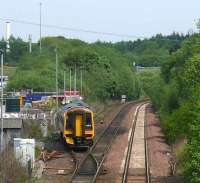 A terminated service from Glasgow Queen Street runs into the down siding at Cumbernauld. Beyond the train there are two verticle lights which indicate buffer stops. The siding was a running loop until 1985.<br><br>[Brian Forbes /05/2008]