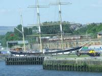 A Class 320 heading West after departure from Exhibition Centre passing by the Glenlee at Glasgow Harbour and Glasgow City Heliport<br><br>[Graham Morgan 26/05/2008]