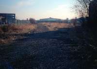 Junction between the line to the original Paisley Terminus (right) and the later curve via Paisley Abercorn to the Glasgow and Paisley Joint Railway (left). The terminus remained in use as a goods yard following closure as a passenger station. View looks south just after the track was lifted.<br><br>[Ewan Crawford //1987]