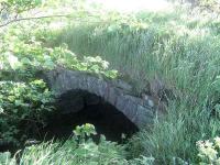 Bridge on the route of the Elgin Railway from Knockhouse (or possibly Berry Law) to Limekilns looking east near Crossford on 20 May 2007. The line of the original route is just to the west of the current aptly named <I>Waggon Road</I> and is in use as a footpath which crosses this bridge. This line opened in 1774 and was in use until c 1810 when the new route between Dunfermline and Charlestown opened. This makes the bridge one of the oldest surviving railway structures in Scotland.<br><br>[Mark Poustie 20/05/2007]