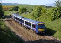 170 456 passes the site of Cowdenbeath North Junction with the 16.08 ex-Waverley train on the Fife inner circle. The line to Glenfarg and Perth branched off to the left where the trees have grown up.<br><br>[Bill Roberton 31/05/2008]