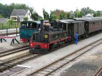 Rush hour with CFBS Haine-St Pierre 2-6-0T No 15 of 1920 and CFBS Cail 2-6-0T No 2 of 1889 waiting to depart for Le Crotoy and St Valery-sur-Somme respectively.  Both are at the head of packed 8 coach trains.  No 2 was built in France for the Panama Canal railway before seeing service in Puerto Rico, returning to France in 1994 after periods in the Henry Ford Museum and at Travers City in Michigan.<br><br>[Mark Poustie 20/08/2006]