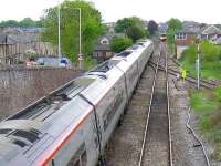 Diverted due to engineering works, a southbound Pendolino stands at Horrocksford Junction on 17 May en route from Hellifield back to the WCML. In the background a local DMU service prepares to undertake a crossover and reverse back into Clitheroe station prior to starting its return journey to Manchester Victoria. Drag locomotive at the head of the Pendolino is <I>Thunderbird</I> 57315 <I>The Mole</I>.<br><br>[John McIntyre 17/05/2008]