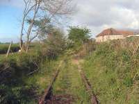 Looking west along the Charlestown Railway from Merryhill Farm Crossing on 20 May 2007. The line begins its long descent from here towards Charlestown Harbour.  This is also the start of the new (1894) alignment to the Harbour.  The former alignment continued on the level until much closer to the Harbour and descended much more steeply, passing over the viaduct shown in photo 17374.<br><br>[Mark Poustie 20/05/2007]