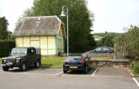 The north end of Moffat station (closed 1954) on 22 May 2008, looking across part of what is now a supermarket car park. A surviving section of the platform stands centre right. The building is the former toilet block which stood on the platform separate from the main station building, originally at the south end of the station. [With thanks to Duncan Brown for additional lavatorial data]<br><br>[John Furnevel 22/05/2008]