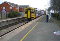 158753 rushes west through Bamber Bridge station towards Preston on 18 March 2008 as restoration work continues on the former station building.<br><br>[John McIntyre 18/03/2008]